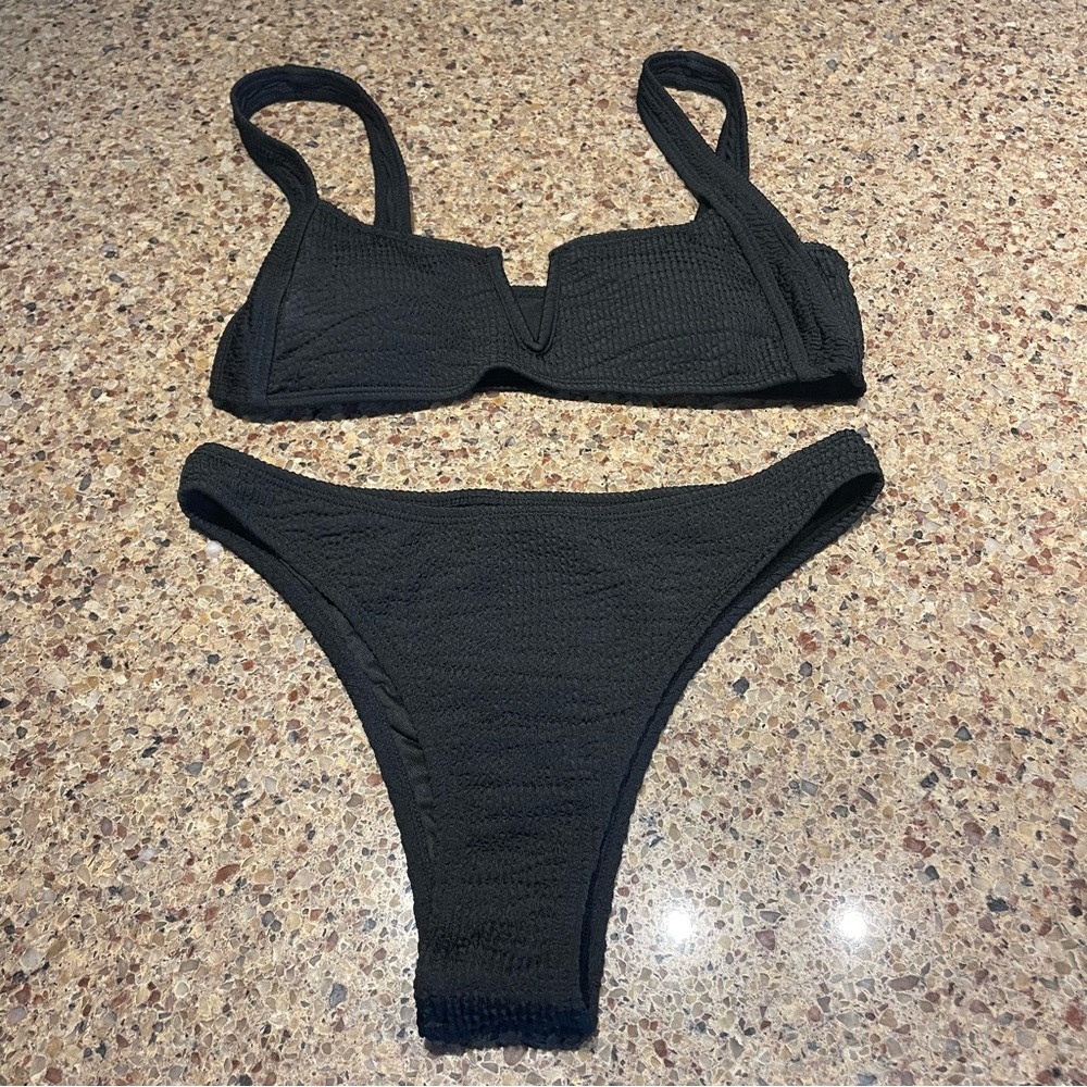 Black Large Bikini. Not adjustable, stretchy comfy fit. Thong style bottom.